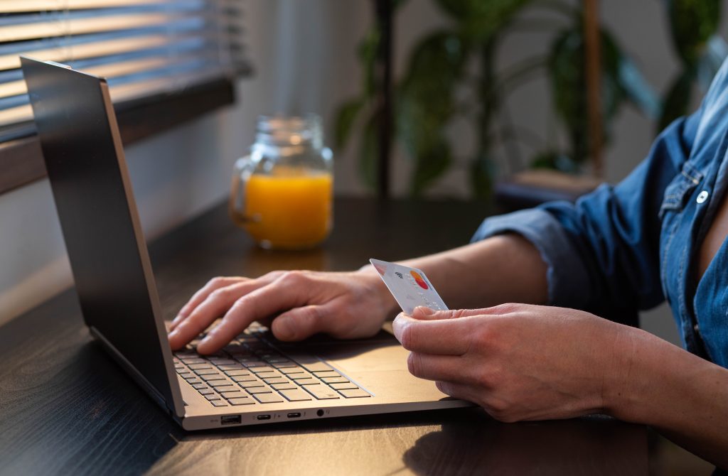 man typing on his computer at a desk