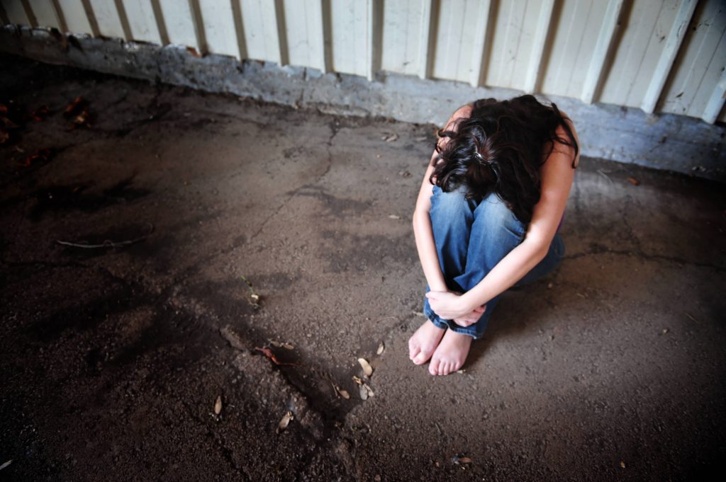 woman alone upset