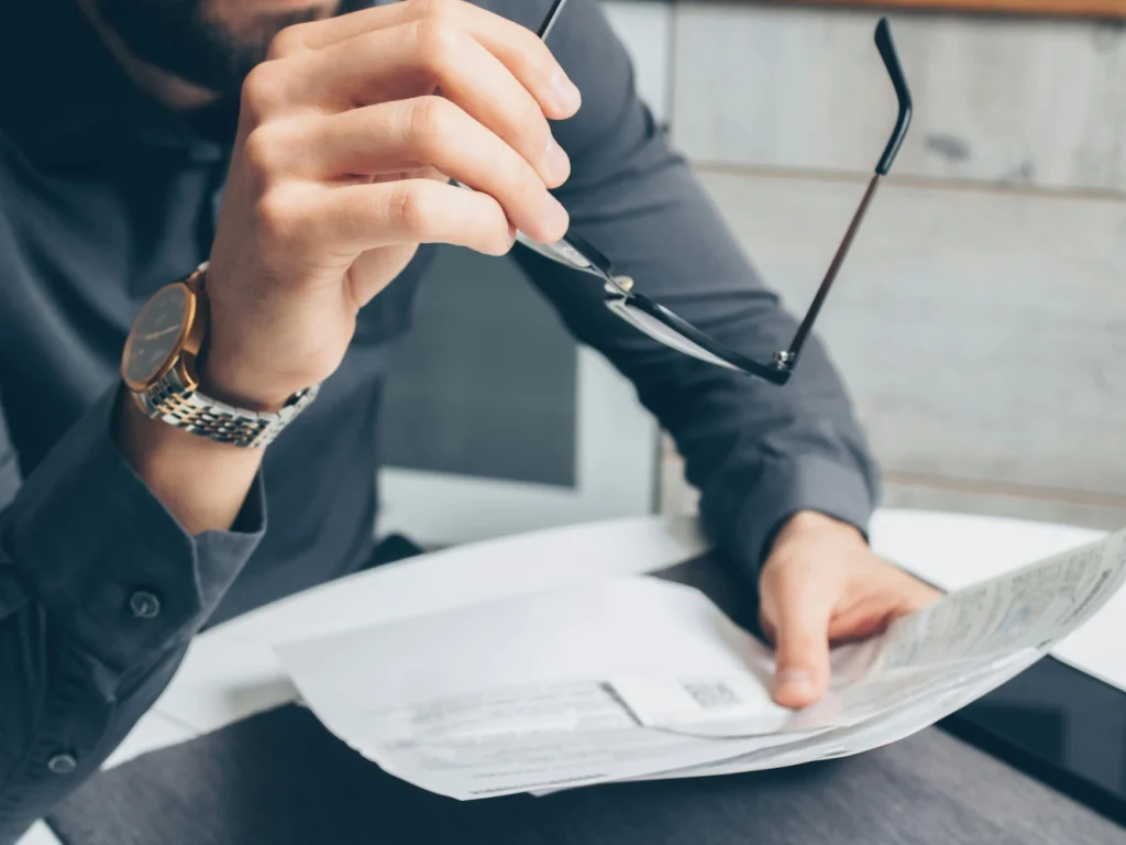 A picture of a man reviewing paperwork